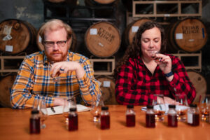 Nora and Adam sipping Lost Lantern Whiskey